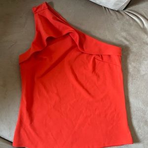 One shoulder top with subtle ruffle.